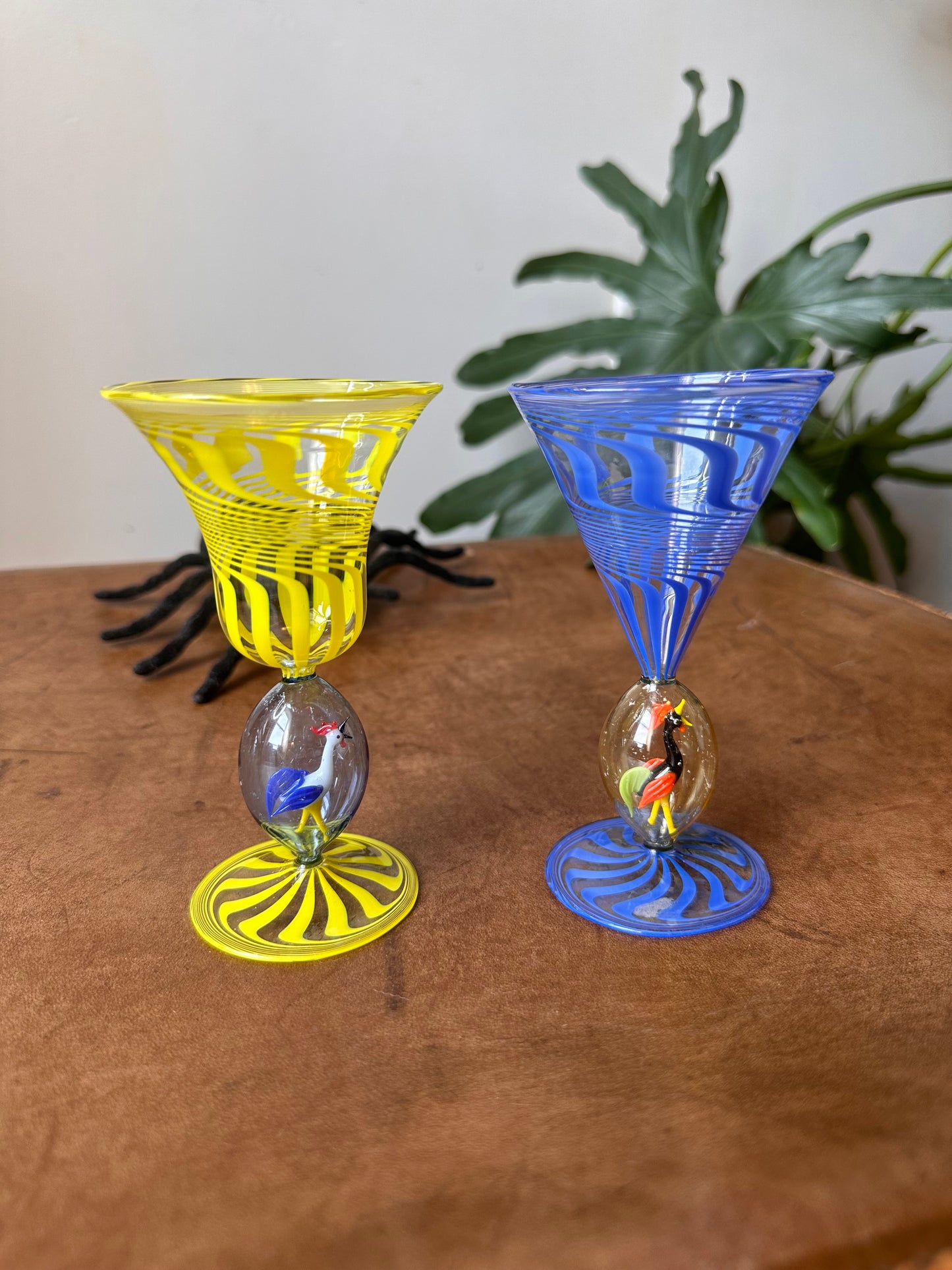 Pair of vintage handblown art glass cups, for cordials or chartreuse. Inside the stem of each glass is a handblown glass rooster. The glasses have a swirled pattern, similar to Bimini of Austria. They may be authentic Bimini!